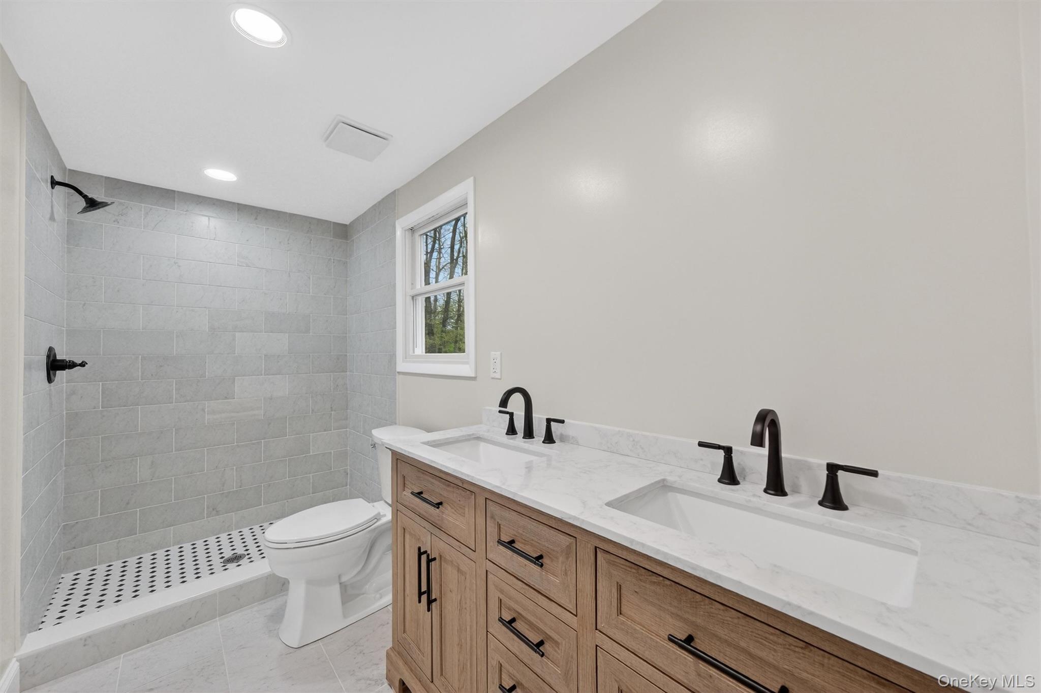 69 Hy Vue Terrace Cold Spring, NY 10516 - Photo 14 of 44 a bathroom with a sink a toilet and a shower