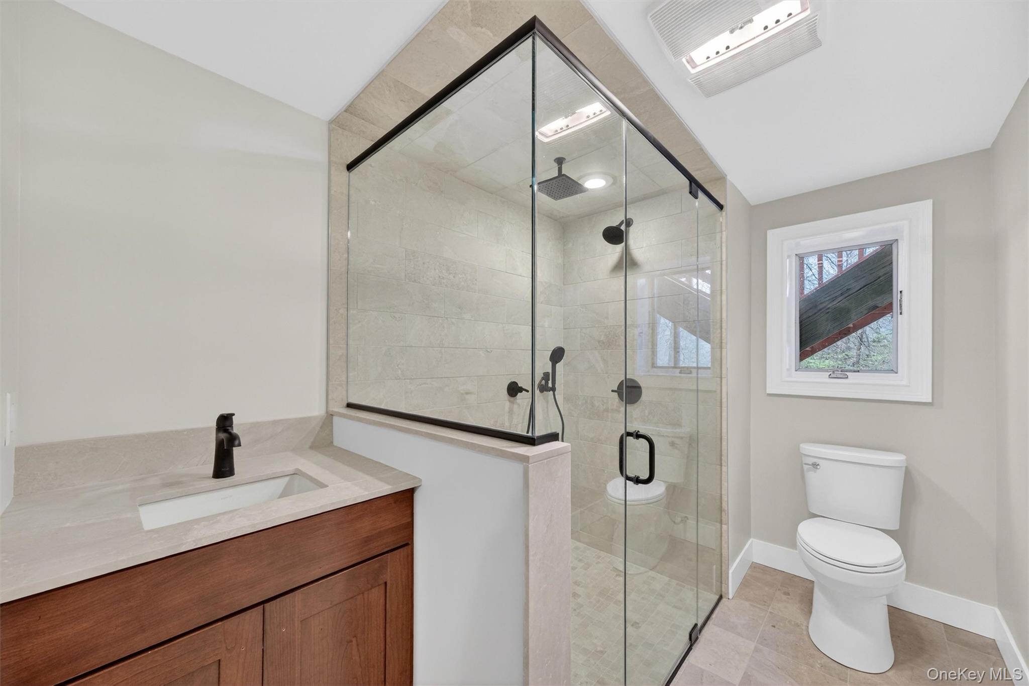 69 Hy Vue Terrace Cold Spring, NY 10516 - Photo 30 of 44 a bathroom with a toilet sink and shower