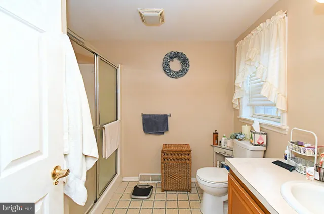 a view of a hallway with paintings on the wall