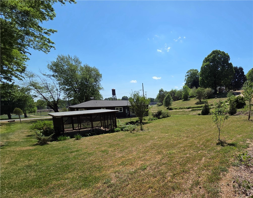 145 Black Oak Ridge Road Taylorsville, NC 28681 - Photo 4 of 39 a view of a house with a yard and sitting area
