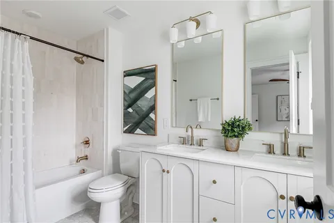 a bathroom with a toilet a sink and a bathtub