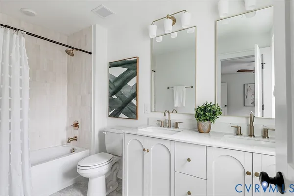 a bathroom with a toilet a sink and a bathtub