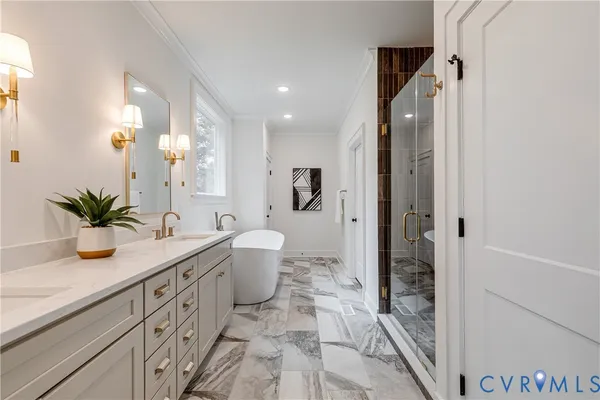 a spacious bathroom with a granite countertop sink a toilet a mirror and shower