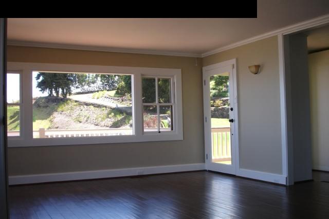 1070 Polipoli Road Kula, HI 96790 - Photo 16 of 20 a view of an empty room with wooden floor and a window