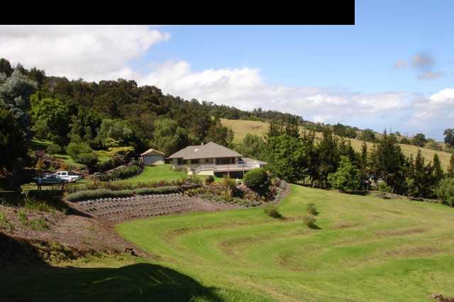 1070 Polipoli Road Kula, HI 96790 - Photo 6 of 20 a view of a town with mountains in the background