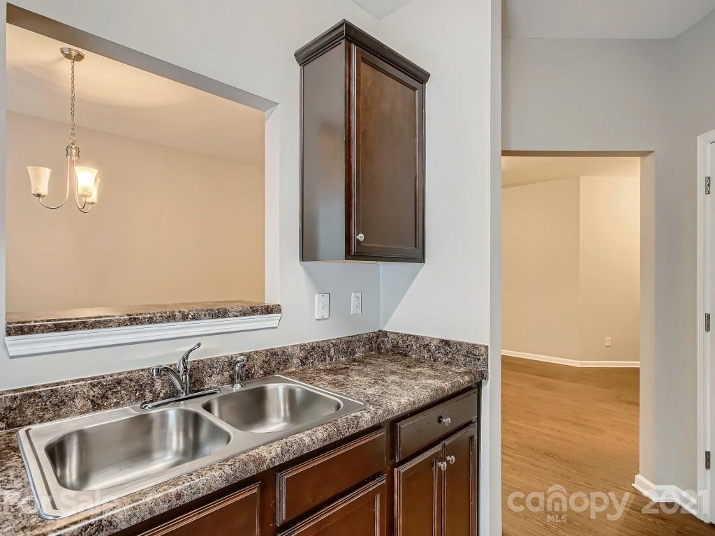 4040 Queensbridge Road Charlotte, NC 28213 - Photo 12 of 28 a bathroom with a sink and a mirror