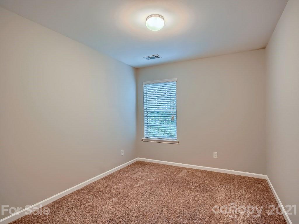 4040 Queensbridge Road Charlotte, NC 28213 - Photo 19 of 28 an empty room with a window