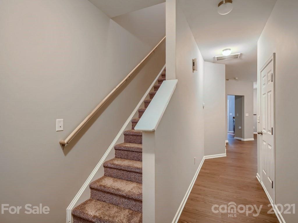 4040 Queensbridge Road Charlotte, NC 28213 - Photo 4 of 28 a view of a hallway with stairs