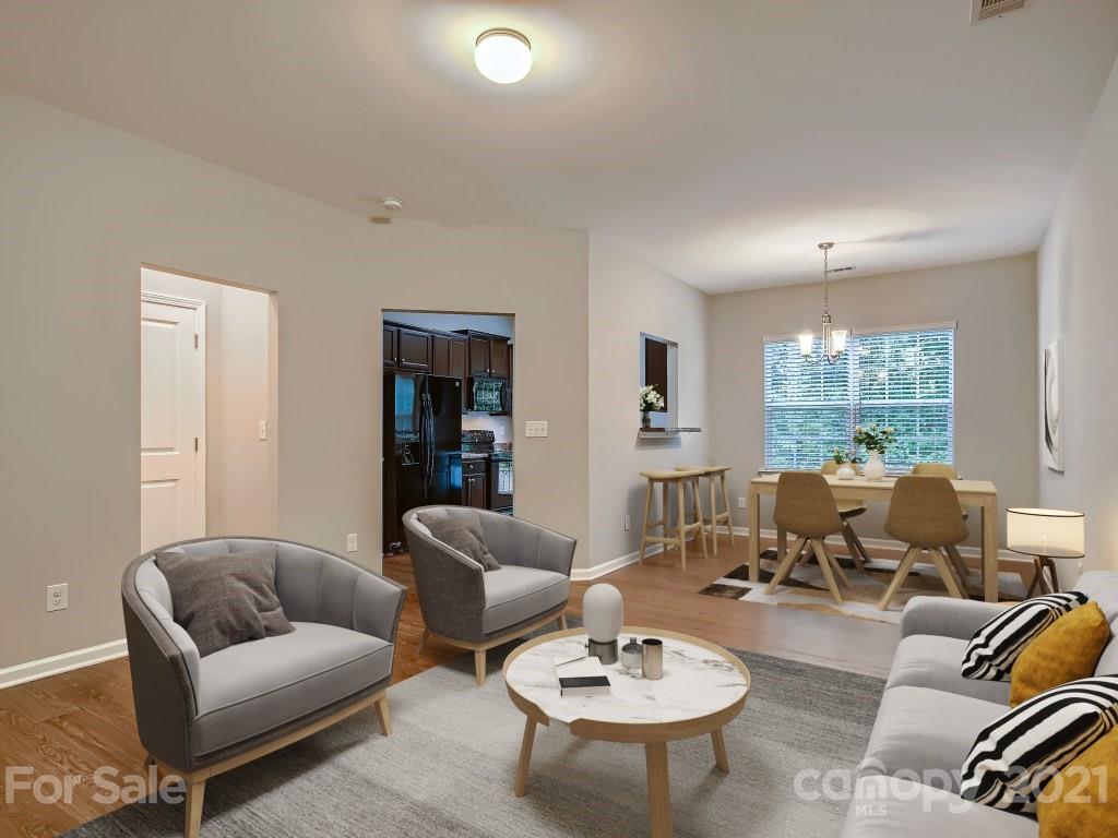 4040 Queensbridge Road Charlotte, NC 28213 - Photo 5 of 28 a living room with furniture and a large window