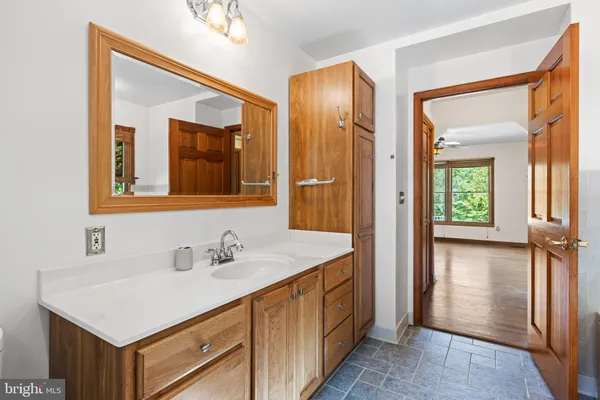 an empty room with windows and closet