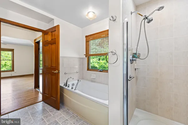 a bathroom with a sink toilet and mirror
