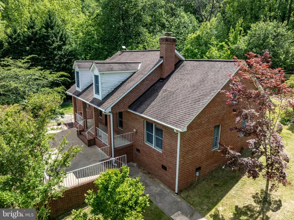 aerial view of a house with a yard
