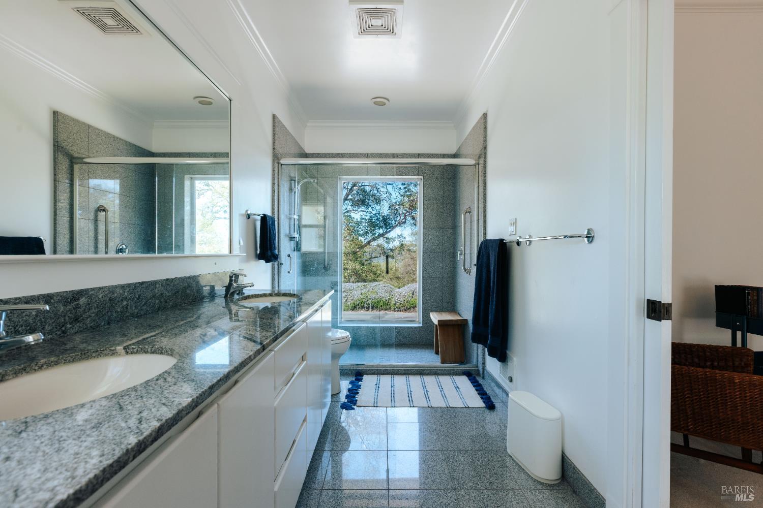 12801 Valley View Drive Ukiah, CA 95482 - Photo 12 of 22 a bathroom with a granite countertop sink a mirror and shower
