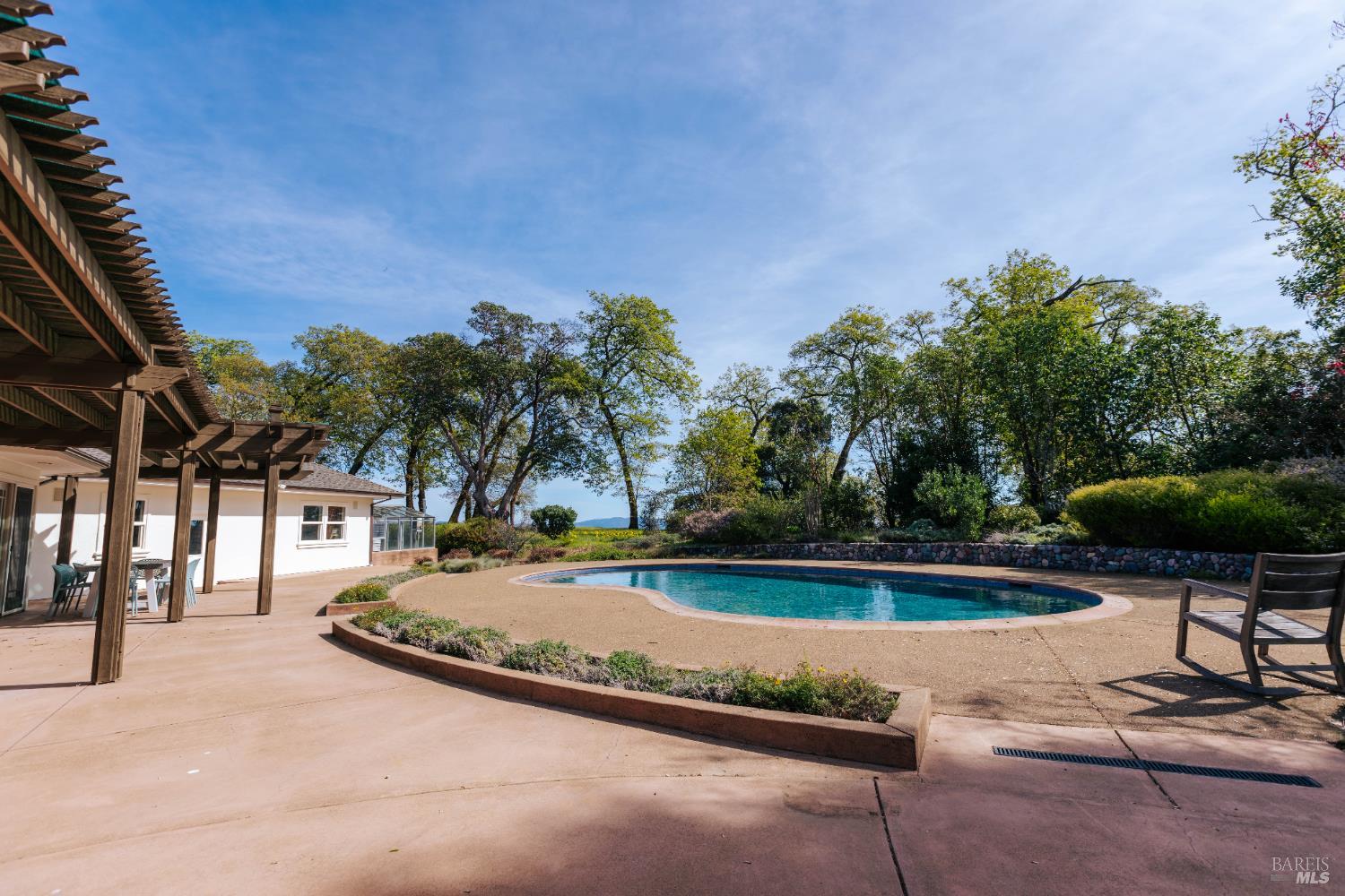 12801 Valley View Drive Ukiah, CA 95482 - Photo 19 of 22 a view of swimming pool with lawn chairs and plants