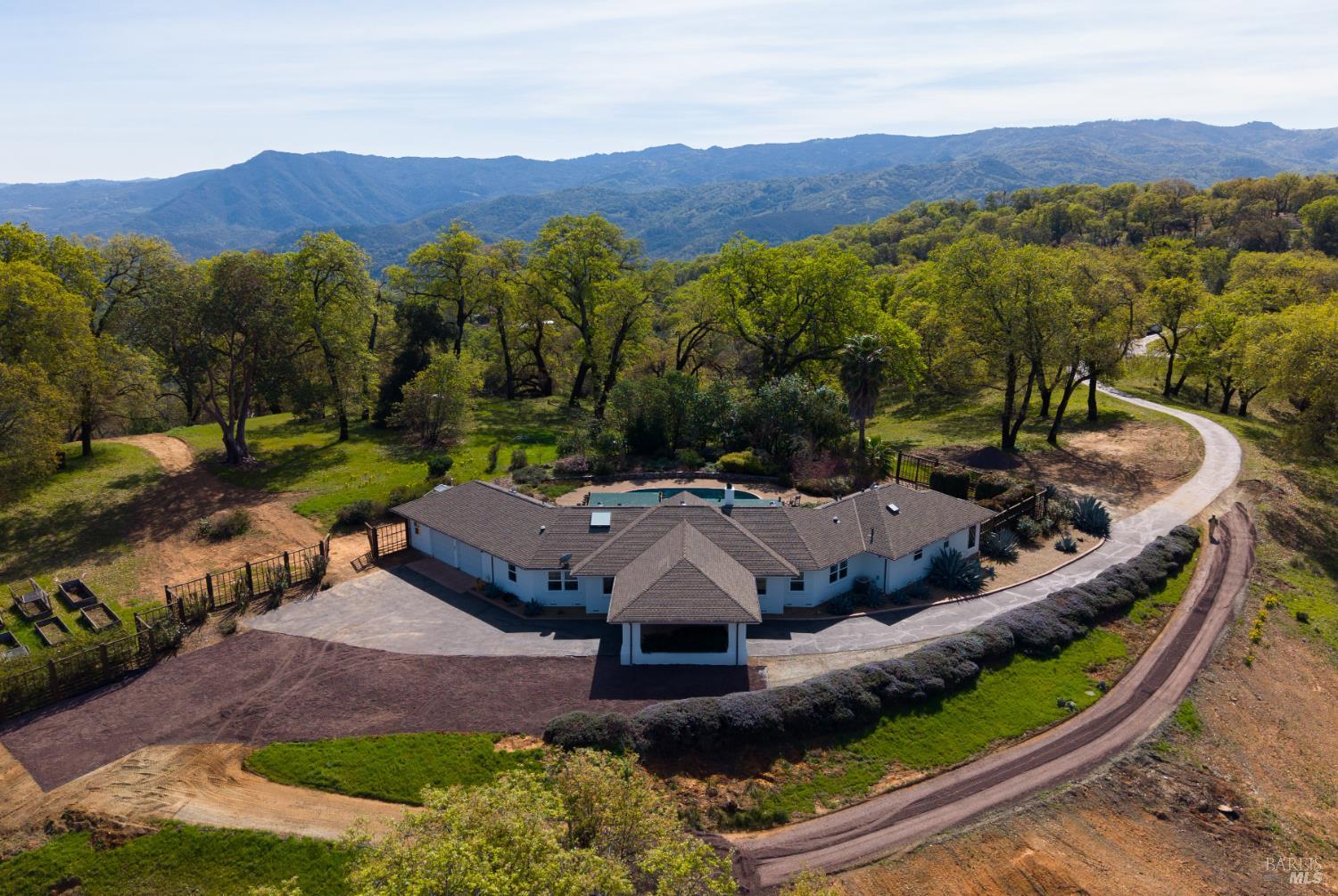 12801 Valley View Drive Ukiah, CA 95482 - Photo 2 of 22 an aerial view of a house with mountain view