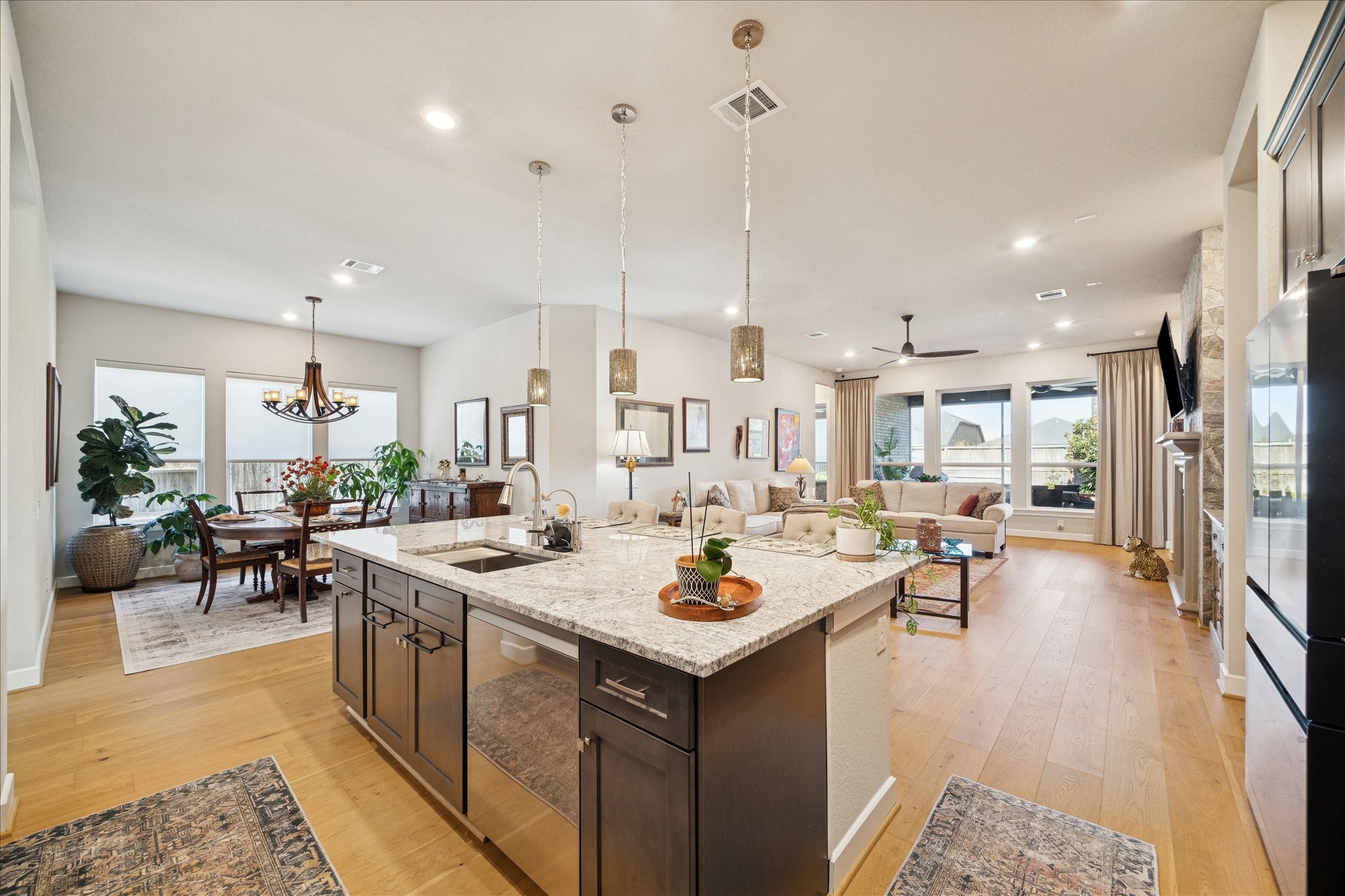 28722 Rising Moon Lane Fulshear, TX 77441 - Photo 11 of 30 a view of a kitchen and living room