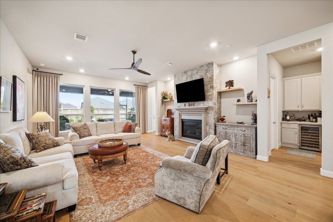 28722 Rising Moon Lane Fulshear, TX 77441 - Photo 15 of 30 a living room with furniture fireplace and flat screen tv