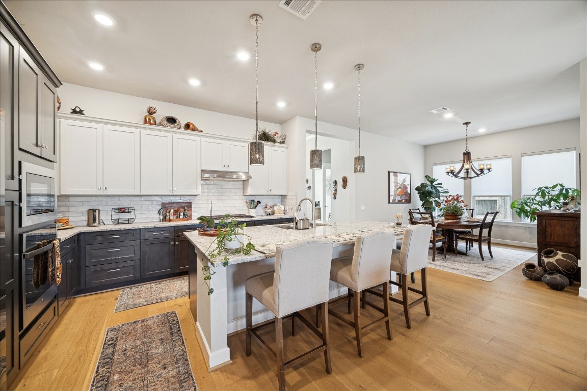 28722 Rising Moon Lane Fulshear, TX 77441 - Photo 16 of 30 a large kitchen with a table and chairs