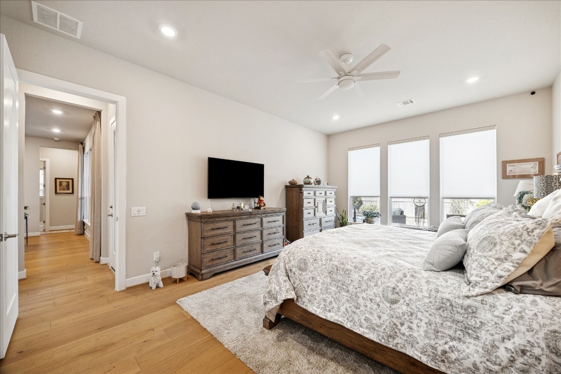 28722 Rising Moon Lane Fulshear, TX 77441 - Photo 19 of 30 a bedroom with a bed and a flat screen tv