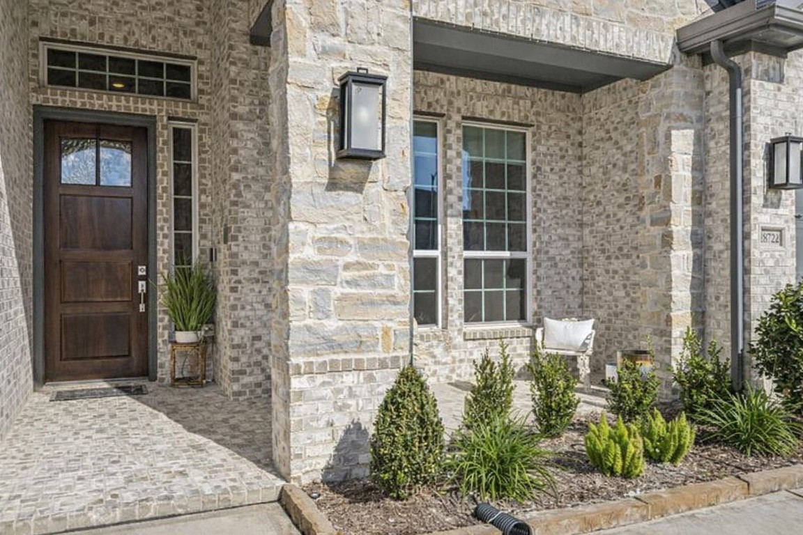 28722 Rising Moon Lane Fulshear, TX 77441 - Photo 2 of 30 a front view of a house with a yard
