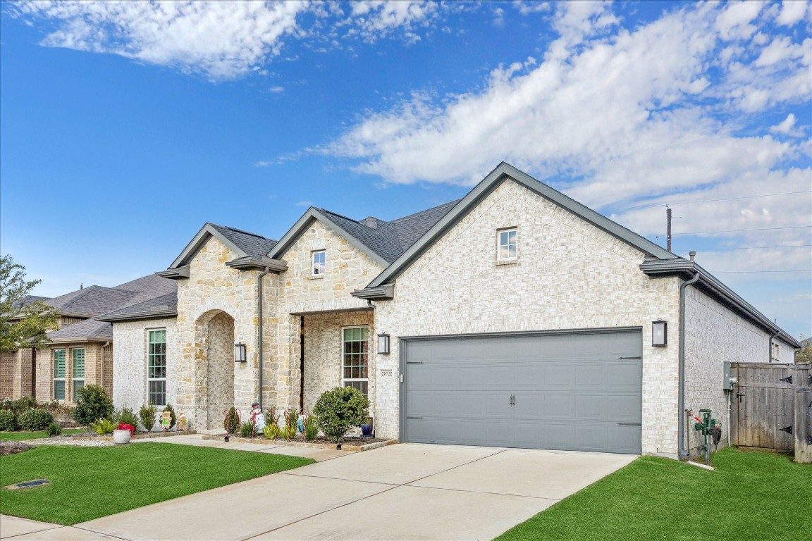 28722 Rising Moon Lane Fulshear, TX 77441 - Photo 30 of 30 a front view of a house with garden