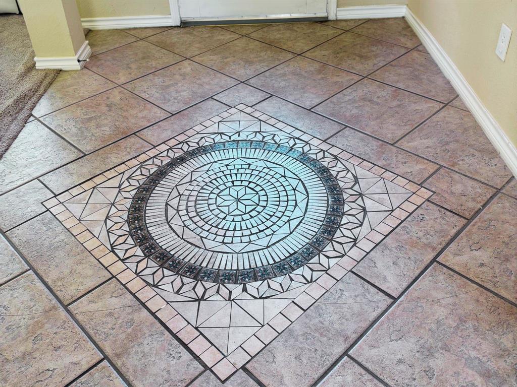 1911 New Haven Road Grapevine, TX 76051 - Photo 16 of 39 Gorgeous decorative tile inserts in the foyer and great room!