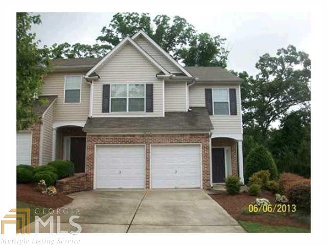 54 Golden Pine Road Southwest Austell, GA 30168 - Photo 1 of 1 a front view of a house with a yard and garage
