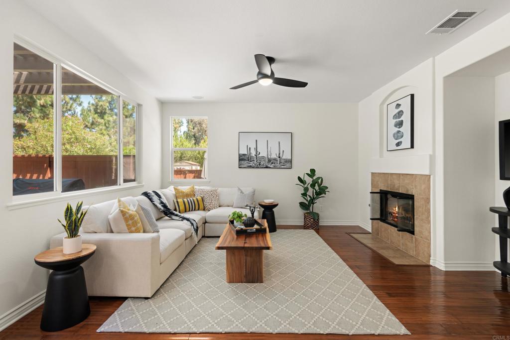 5439 Foxtail Loop Carlsbad, CA 92010 - Photo 11 of 47 a living room with furniture and a fireplace