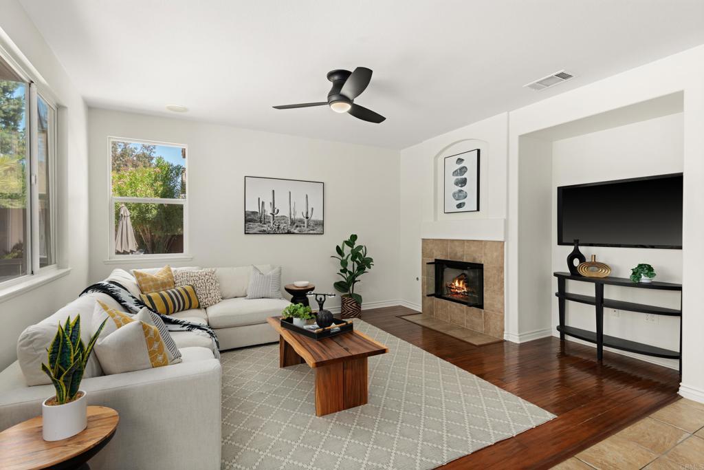 5439 Foxtail Loop Carlsbad, CA 92010 - Photo 17 of 47 a living room with furniture and a fireplace