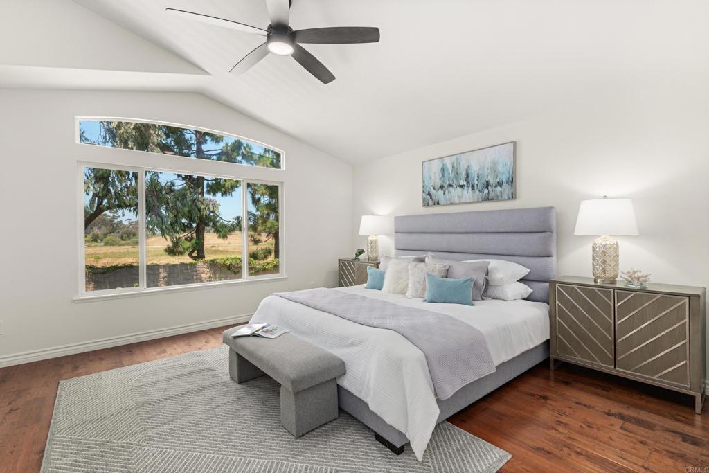 5439 Foxtail Loop Carlsbad, CA 92010 - Photo 18 of 47 a bedroom with a large bed and a window