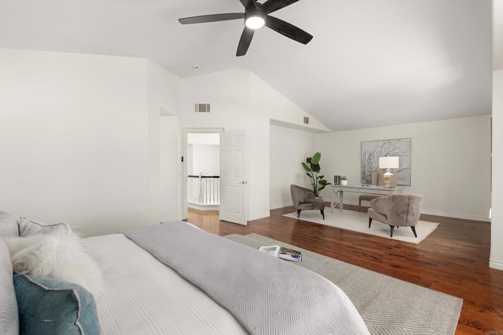 5439 Foxtail Loop Carlsbad, CA 92010 - Photo 20 of 47 a living room with furniture and a wooden floor