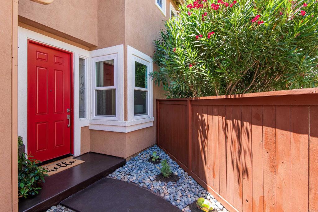 5439 Foxtail Loop Carlsbad, CA 92010 - Photo 2 of 47 a front view of a house with a yard