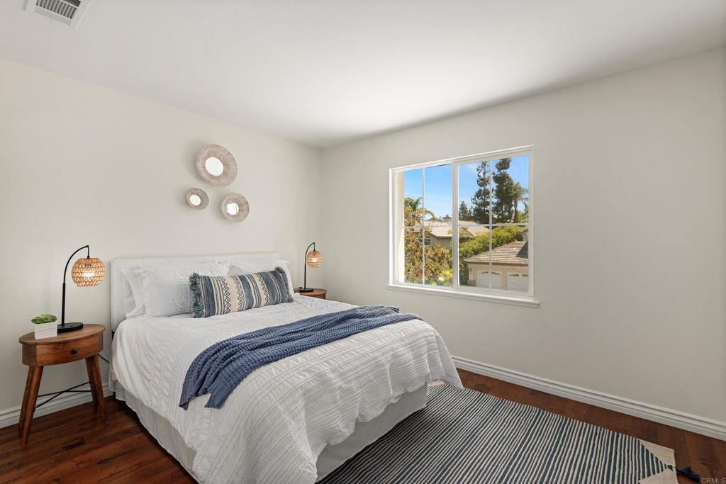 5439 Foxtail Loop Carlsbad, CA 92010 - Photo 26 of 47 a bedroom with bed and a window