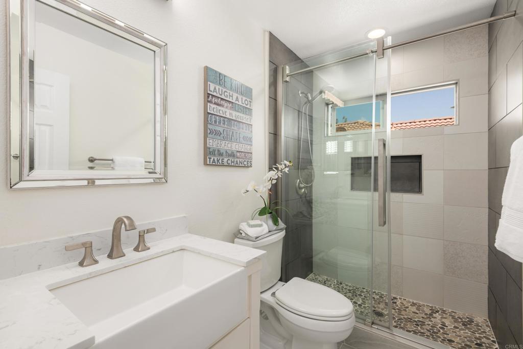 5439 Foxtail Loop Carlsbad, CA 92010 - Photo 30 of 47 a bathroom with a sink toilet and shower