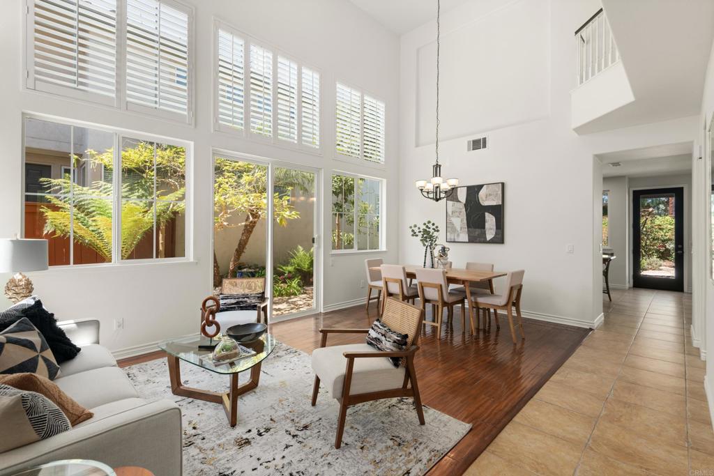 5439 Foxtail Loop Carlsbad, CA 92010 - Photo 3 of 47 a dining room with furniture window and wooden floor
