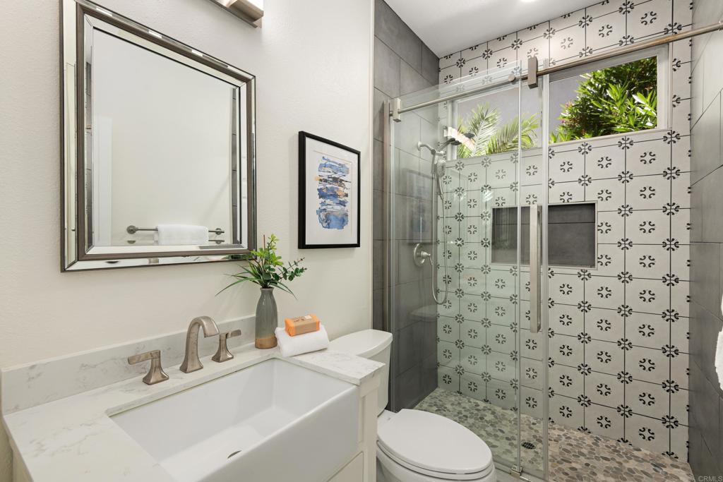 5439 Foxtail Loop Carlsbad, CA 92010 - Photo 33 of 47 a bathroom with a sink toilet and shower