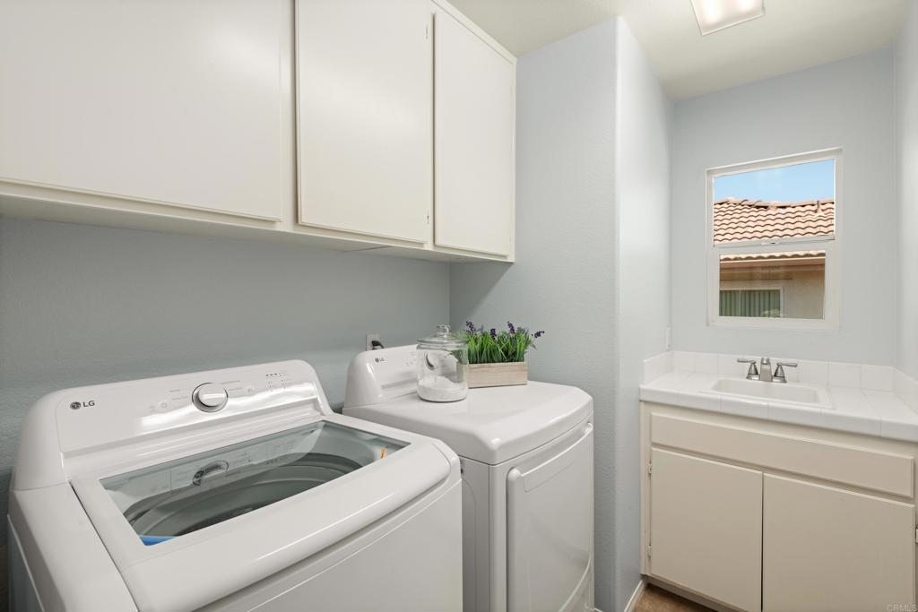 5439 Foxtail Loop Carlsbad, CA 92010 - Photo 34 of 47 a utility room with dryer and washer