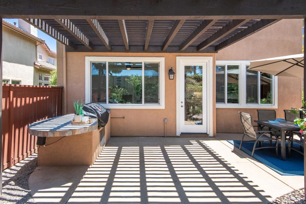 5439 Foxtail Loop Carlsbad, CA 92010 - Photo 36 of 47 a living room with a couch and a table