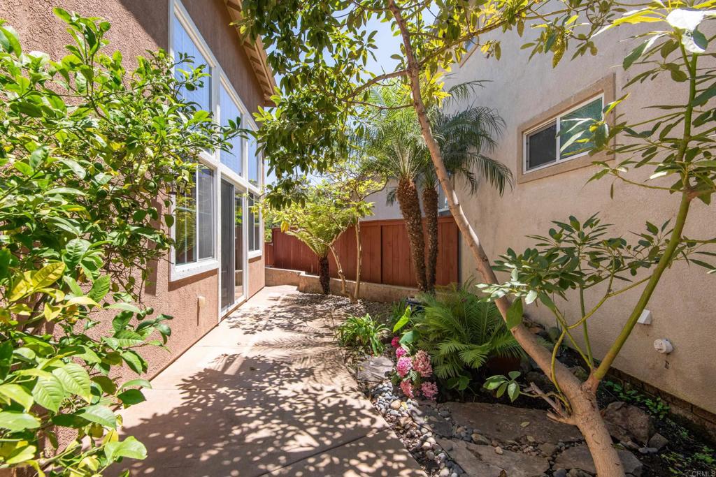 5439 Foxtail Loop Carlsbad, CA 92010 - Photo 42 of 47 a backyard of a house with lots of green space