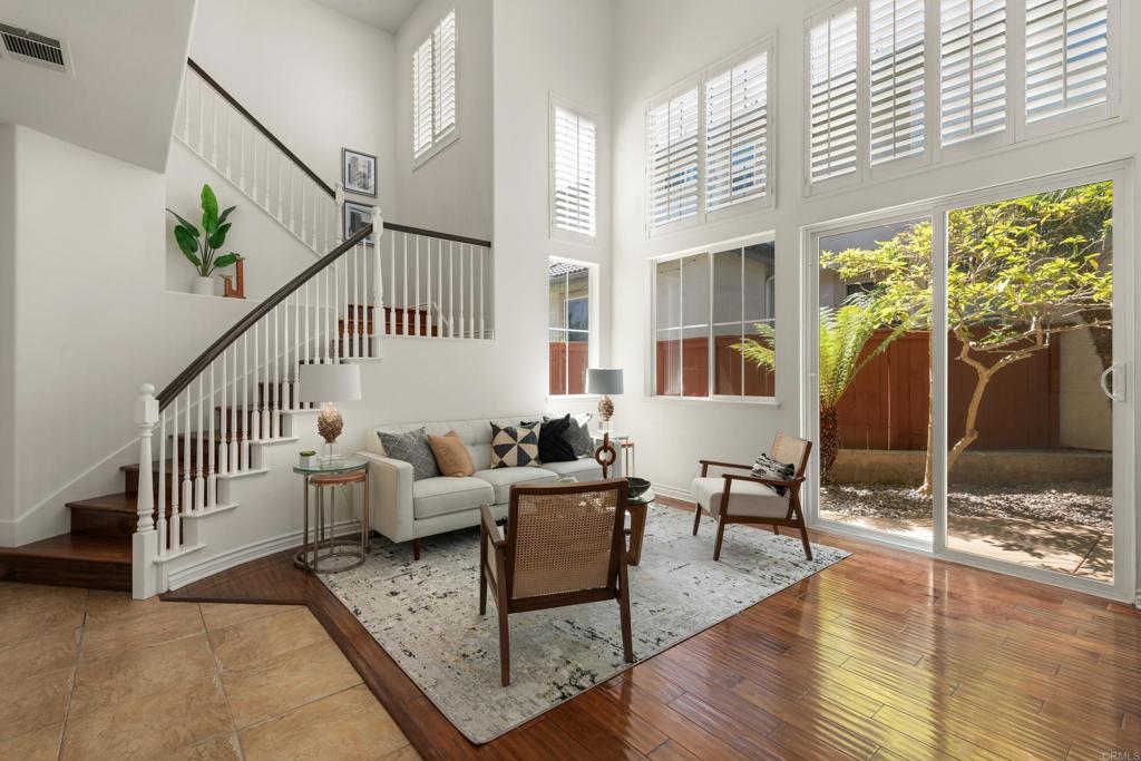 5439 Foxtail Loop Carlsbad, CA 92010 - Photo 5 of 47 a living room with furniture and a table