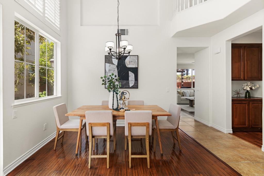 5439 Foxtail Loop Carlsbad, CA 92010 - Photo 6 of 47 a view of a dining room with furniture window and wooden floor