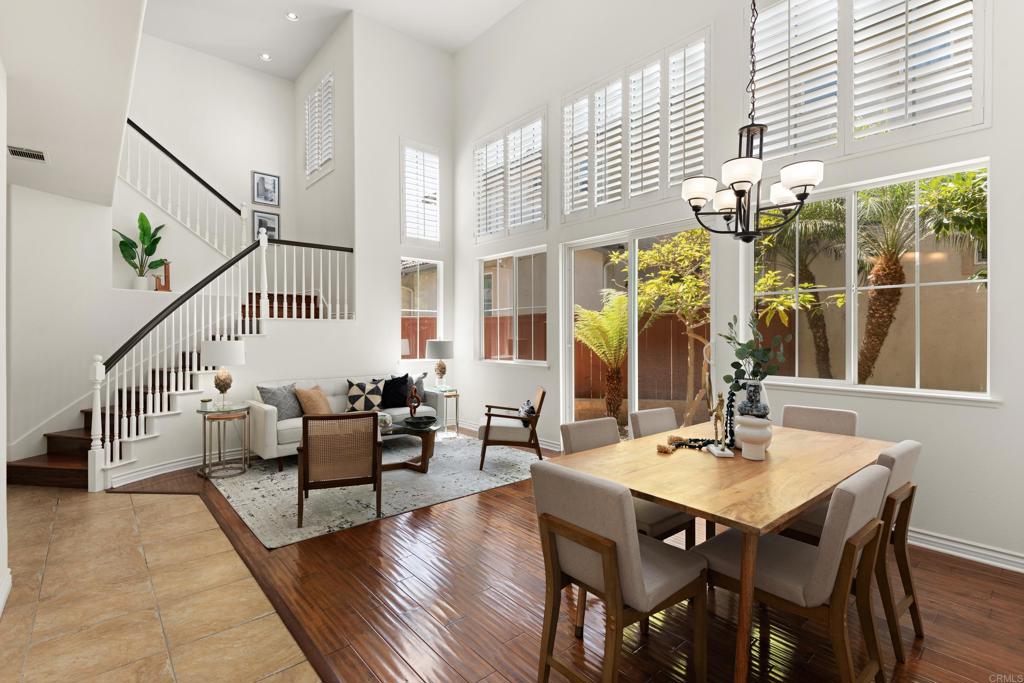 5439 Foxtail Loop Carlsbad, CA 92010 - Photo 8 of 47 a dining room with wooden floor table and chairs
