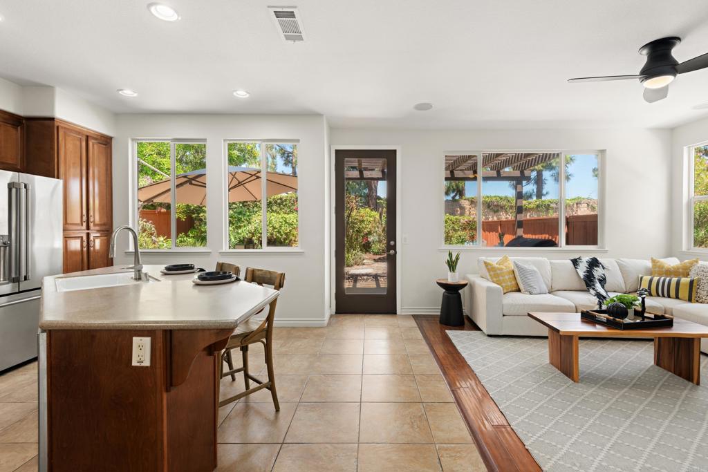 5439 Foxtail Loop Carlsbad, CA 92010 - Photo 9 of 47 a living room with furniture and large windows