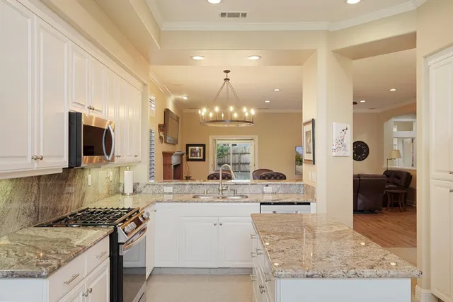 a kitchen with a sink stove and refrigerator