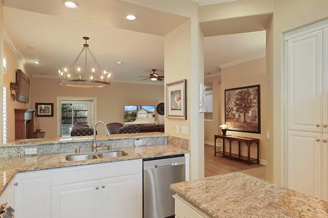 a kitchen with center island and cabinets
