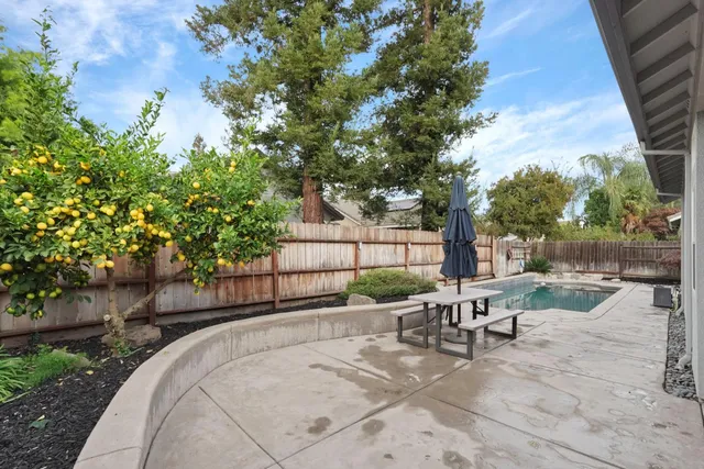 a view of a backyard with sitting area