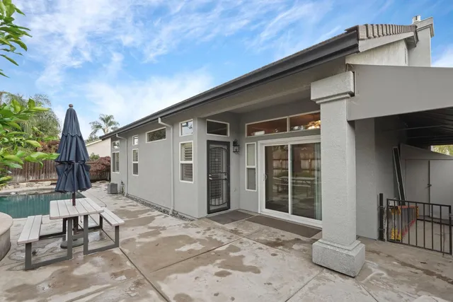 a view of a swimming pool with a patio
