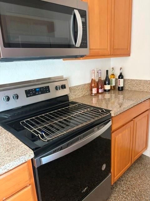 11601 109th Street Seminole, FL 33778 - Photo 12 of 29 a stove top oven sitting inside of a kitchen