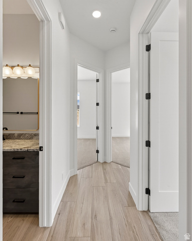 2862 South Mountain Rnch Road Cedar City, UT 84720 - Photo 32 of 64 Hallway featuring wood-finish flooring, white walls, and recessed lighting