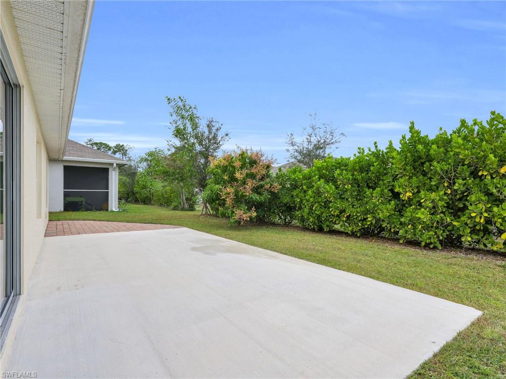 731 Hadley Place West Naples, FL 34104 - Photo 30 of 30 Patio and Rear Yard With Calusia Hedge And Privacy Landscaping